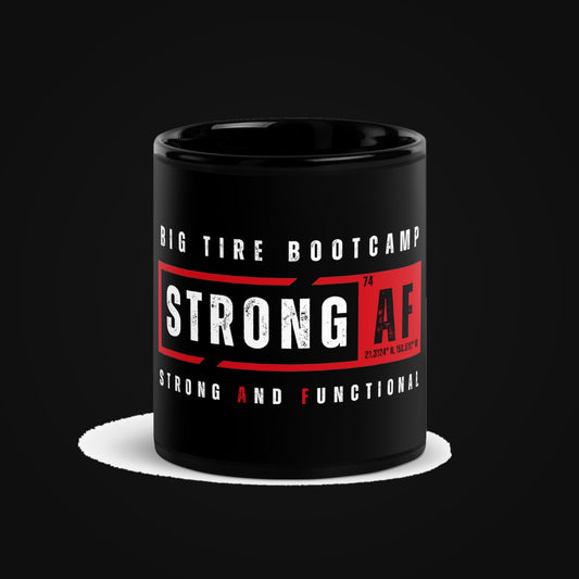 STRONG AF Black Glossy Ceramic Mug on dark
