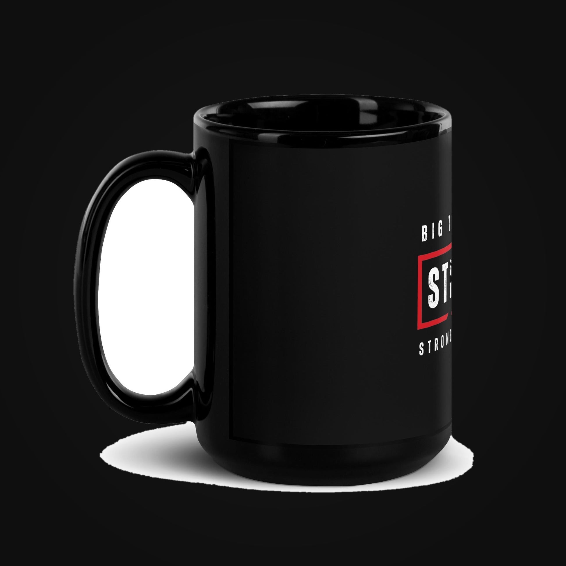 STRONG AF Black Glossy Ceramic Mug on dark